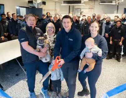 The Ashton family and team at a ribbon-cutting celebration